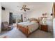 Cozy main bedroom with neutral tones, carpeted floor, and a ceiling fan at 10710 Destination Ln # 201, Las Vegas, NV 89144