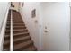 Stairway leading to upper level with carpeted steps and handrail at 10710 Destination Ln # 201, Las Vegas, NV 89144