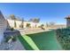 Landscaped backyard featuring firepit and tiered patio areas at 12270 Monument Hill Ave, Las Vegas, NV 89138