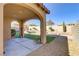 Landscaped backyard oasis with covered patio and artificial turf at 12270 Monument Hill Ave, Las Vegas, NV 89138