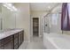 Elegant bathroom featuring granite countertops and a walk-in shower at 12270 Monument Hill Ave, Las Vegas, NV 89138