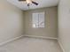 Spacious bedroom with window and ceiling fan at 12270 Monument Hill Ave, Las Vegas, NV 89138