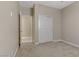 Well-lit bedroom featuring double doors and closet at 12270 Monument Hill Ave, Las Vegas, NV 89138