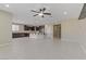 Open living area with tile floor and view of kitchen at 12270 Monument Hill Ave, Las Vegas, NV 89138