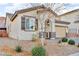 Modern stucco home with dark brown accents and drought-tolerant landscaping at 145 Langley Hill Ave, Henderson, NV 89002