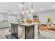 Kitchen island with seating and stainless steel dishwasher at 145 Langley Hill Ave, Henderson, NV 89002