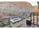 Patio with fire pit and view of rock wall at 145 Langley Hill Ave, Henderson, NV 89002