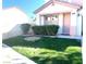 This cozy home features a manicured front lawn with shrubs at 319 Fox Lake Ave, Las Vegas, NV 89148