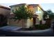 Two-story house with attached garage and landscaping at 3367 Villa Fiori Ave, Las Vegas, NV 89141