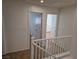 Upstairs hallway with doors to bedrooms and tile floors at 3367 Villa Fiori Ave, Las Vegas, NV 89141