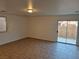 Living room with tile floors and sliding glass doors at 3367 Villa Fiori Ave, Las Vegas, NV 89141