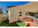 Backyard with covered patio and play equipment at 3464 Trilogy Dr, Las Vegas, NV 89108