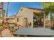 Backyard patio with table, chairs, and hot tub at 3464 Trilogy Dr, Las Vegas, NV 89108