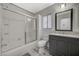 Updated bathroom with gray vanity, a shower/tub combo, and a large mirror at 3464 Trilogy Dr, Las Vegas, NV 89108