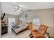 Vaulted ceiling bedroom with wood-look floors and a ceiling fan at 3464 Trilogy Dr, Las Vegas, NV 89108