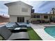 Inviting backyard featuring a pool, patio, and lush landscaping at 5882 W Viking Rd, Las Vegas, NV 89103