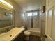 Updated bathroom features tiled shower over tub, designer mirror, and modern vanity at 5882 W Viking Rd, Las Vegas, NV 89103
