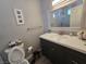 Bathroom with vanity, toilet and modern decor at 5882 W Viking Rd, Las Vegas, NV 89103