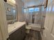 Updated bathroom with a vanity, bathtub, and shower at 5882 W Viking Rd, Las Vegas, NV 89103