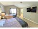 Bright bedroom featuring two beds and wood floors at 5882 W Viking Rd, Las Vegas, NV 89103