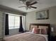 Bedroom with ceiling fan and built in shelving at 5882 W Viking Rd, Las Vegas, NV 89103