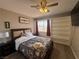 Charming bedroom with ample natural light, ceiling fan, and large closet at 5882 W Viking Rd, Las Vegas, NV 89103
