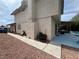 View of the home's exterior with a patio, outdoor grill, and a glimpse of the pool area at 5882 W Viking Rd, Las Vegas, NV 89103