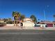 Single-story house with palm trees and a two-car garage at 5882 W Viking Rd, Las Vegas, NV 89103