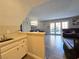 Small kitchenette with sink and white cabinets at 5882 W Viking Rd, Las Vegas, NV 89103