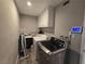 Laundry room with washer, dryer, and storage at 5882 W Viking Rd, Las Vegas, NV 89103