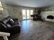 Bright living room with hardwood floors and fireplace at 5882 W Viking Rd, Las Vegas, NV 89103