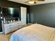 Bright bedroom with large bed, dresser, and TV at 9306 Colinton Ct, Las Vegas, NV 89178