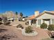 Landscaped backyard with gravel and desert plants at 11037 Hawk Valley Ave, Las Vegas, NV 89134