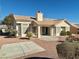 House with a backyard patio and desert landscaping at 11037 Hawk Valley Ave, Las Vegas, NV 89134