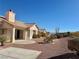 A covered patio with desert landscaping providing a serene outdoor living space at 11037 Hawk Valley Ave, Las Vegas, NV 89134