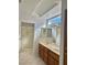 Double vanity bathroom with large mirror and shower at 11037 Hawk Valley Ave, Las Vegas, NV 89134