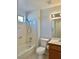 Standard bathroom featuring a shower-tub combo, single sink vanity, and tile flooring at 11037 Hawk Valley Ave, Las Vegas, NV 89134