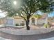 One-story house with attractive landscaping and a large tree at 11037 Hawk Valley Ave, Las Vegas, NV 89134