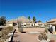 Landscaped front yard with mountain view in background at 11037 Hawk Valley Ave, Las Vegas, NV 89134