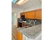 Updated kitchen with granite countertops and wood cabinets at 11037 Hawk Valley Ave, Las Vegas, NV 89134