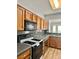 Well-equipped kitchen featuring granite countertops, stainless steel dishwasher, and gas range at 11037 Hawk Valley Ave, Las Vegas, NV 89134