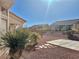 Side yard with gravel, stone pathway, and desert plants at 11037 Hawk Valley Ave, Las Vegas, NV 89134