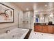 Bathroom with a soaking tub, glass shower, and modern vanity at 145 E Harmon Ave # 2321, Las Vegas, NV 89109