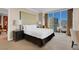 Bedroom with king-size bed and stunning city views at 145 E Harmon Ave # 2321, Las Vegas, NV 89109