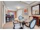 Bright dining area with glass table and four chairs, adjacent to a kitchen at 145 E Harmon Ave # 2321, Las Vegas, NV 89109