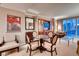 Dining area with a round glass table and four chairs, near the living room at 145 E Harmon Ave # 2321, Las Vegas, NV 89109