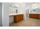 Double vanity bathroom with a large shower and tile flooring at 1722 Game Garden Rd, North Las Vegas, NV 89031