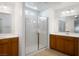 Elegant bathroom featuring double sinks and a shower at 1722 Game Garden Rd, North Las Vegas, NV 89031