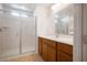 Bathroom with a large shower and wood vanity at 1722 Game Garden Rd, North Las Vegas, NV 89031