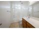 Clean bathroom, bathtub shower combo, and wood vanity at 1722 Game Garden Rd, North Las Vegas, NV 89031